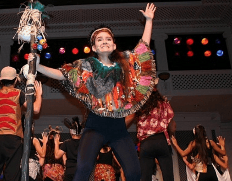 teenage girl performing onstage