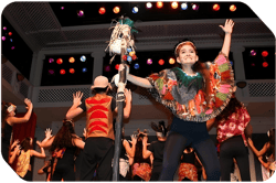 high school students in costume perform the lion king musical onstage